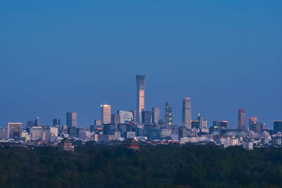 Panoramic view of buildings against blue sky