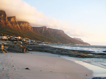 Scenic view of beach against sky during sunset