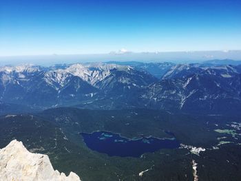 High angle view of mountains against clear blue sky