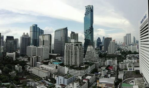 Modern buildings in city against sky