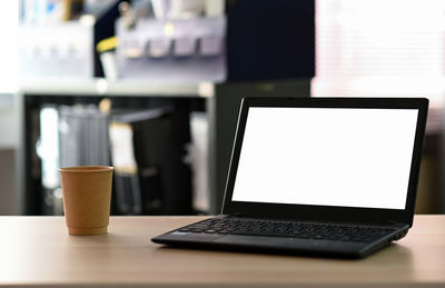 Close-up of laptop on table