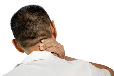 Rear view of man against white background