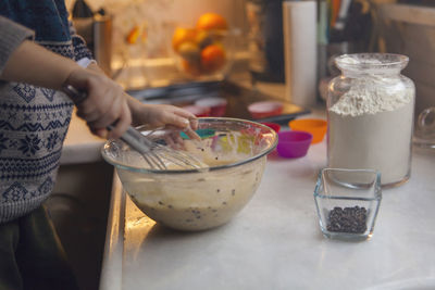 Midsection of man preparing food on table at home