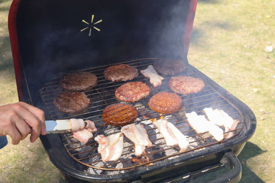 High angle view of meat cooking on barbecue grill