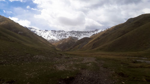 Scenic view of snowcapped mountains against sky