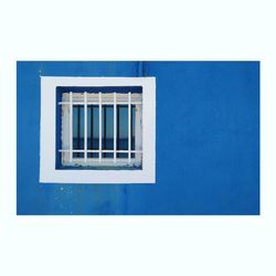 Window on white wall of building