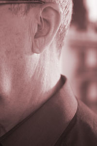 Close-up of man with hearing aid