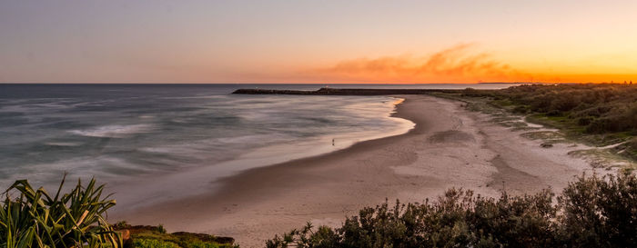 Scenic view of beach during sunset