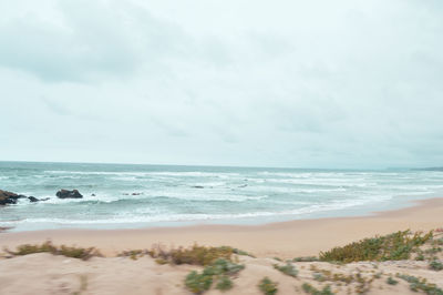 Scenic view of beach against sky