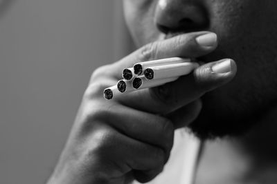 Close-up of man smoking cigarettes