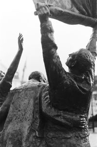 Low angle view of statue against sky