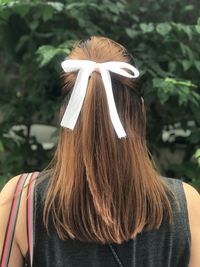 Rear view of woman with umbrella