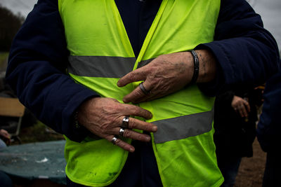 Midsection of man holding hands