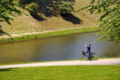 Man riding bicycle on road
