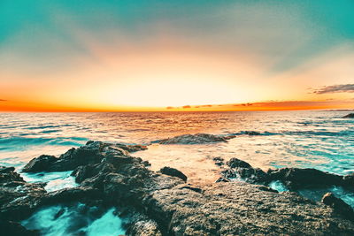 Scenic view of sea against sky during sunset