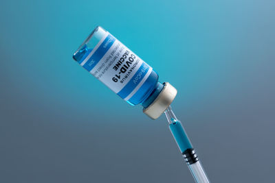 Close-up of telephone booth against blue background