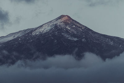 Scenic view of snowcapped mountain against sky