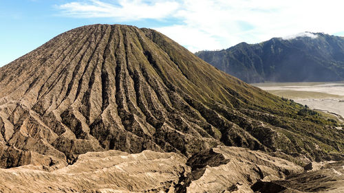 Panoramic view of volcanic landscape against sky