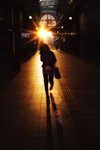 Full length of woman walking on footbridge