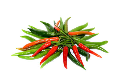 Close-up of red chili pepper against white background