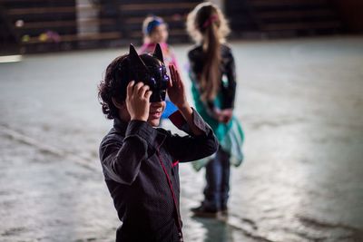 Full length of child photographing