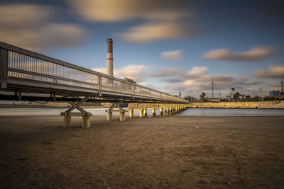 Bridge over sea against sky