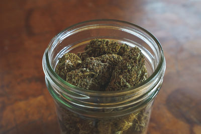 High angle view of glass jar on table