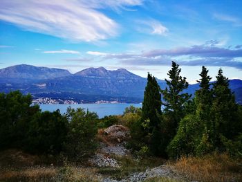 Scenic view of lake against cloudy sky