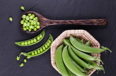 High angle view of vegetables on table against black background