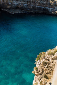 High angle view of sea against blue sky