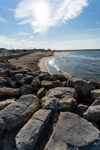 Scenic view of sea shore against sky