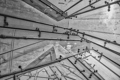 High angle view of railroad tracks seen through glass