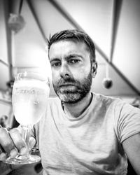 Portrait of man drinking glass