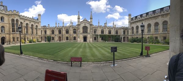 View of buildings against cloudy sky in cambridge 