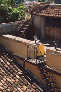 Empty chairs on table by building