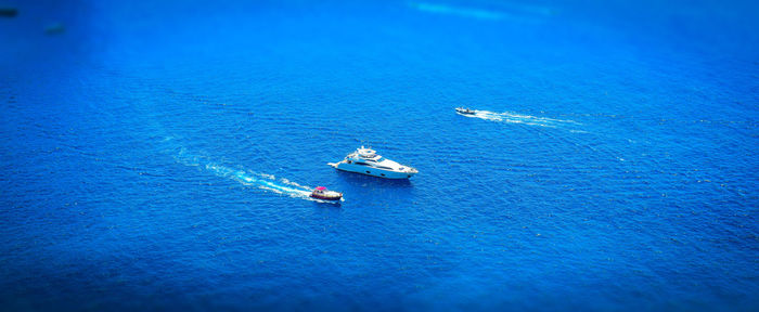 High angle view of boat sailing in sea