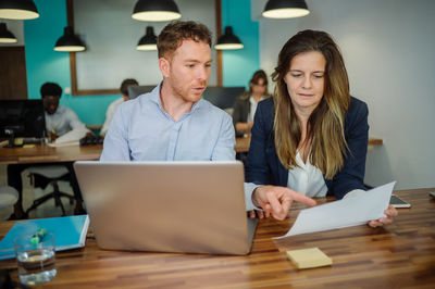 Business colleagues discussing at office