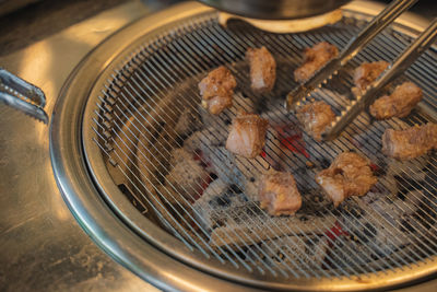 Close-up of meat on barbecue grill