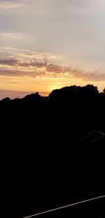 Scenic view of silhouette landscape against sky during sunset