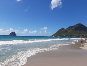 Scenic view of sea against blue sky