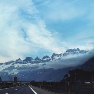 Scenic view of snow covered mountains against sky