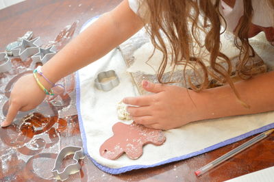 High angle view of woman preparing food on table