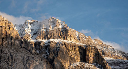 Mountain landscape with dolomite rocky peak covered with snow in the alps of south tyrol in italy