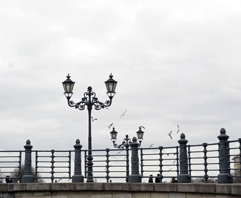 Low angle view of street light against sky