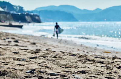 Full length of man on beach against sky