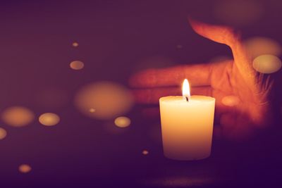 Close-up of illuminated candle