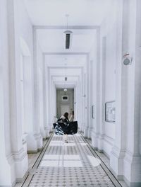 People sitting in corridor