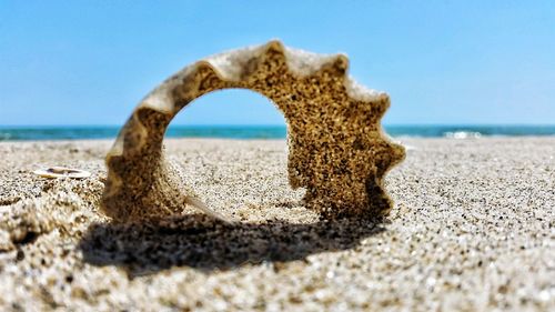 Scenic view of beach against blue sky