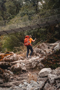 Full length of man standing on rock