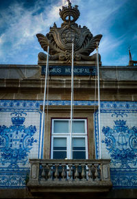 Low angle view of building against blue sky